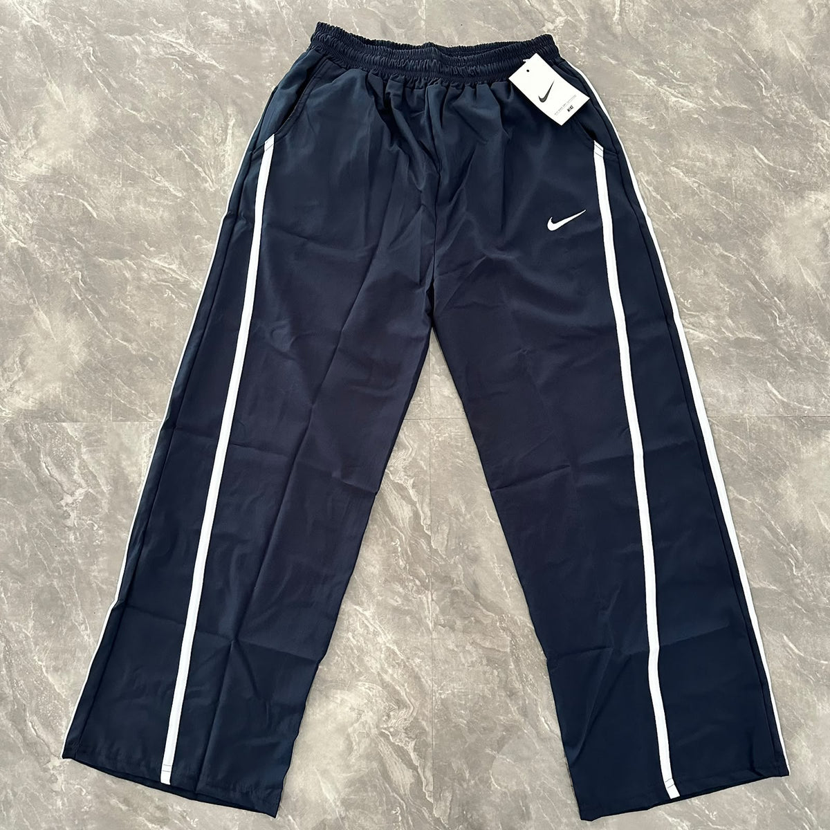 BAGGY NIKE TELA ROMPEVIENTOS